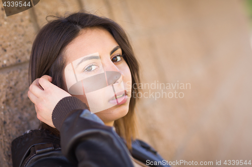 Image of Beautiful Meloncholy Mixed Race Young Woman Portrait Outside.