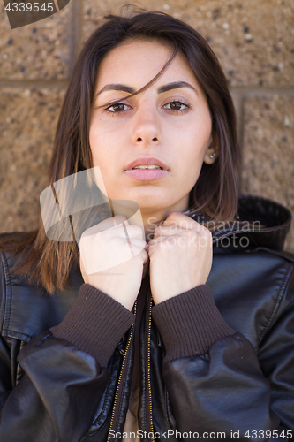 Image of Beautiful Meloncholy Mixed Race Young Woman Portrait Outside.