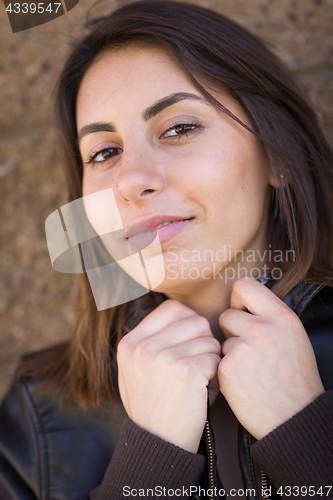 Image of Beautiful Meloncholy Mixed Race Young Woman Portrait Outside.