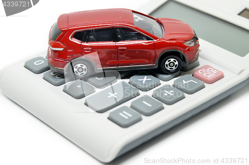 Image of Calculator and toy car