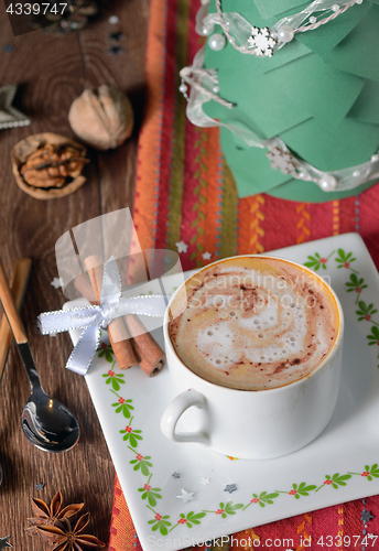 Image of Cup of coffee and Christmas decorations