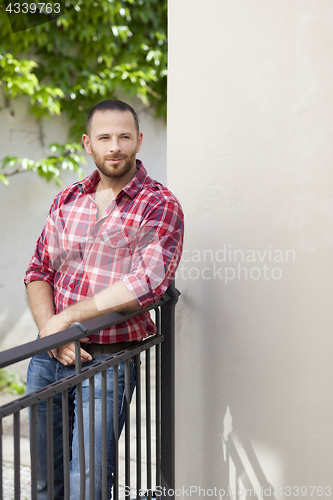 Image of bearded handsome man relaxing