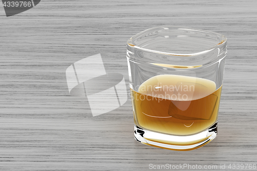 Image of Glass of whisky on wood background