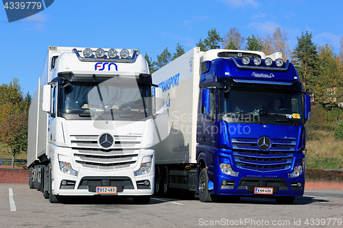 Image of White and Blue Mercedes-Benz Actros Trucks