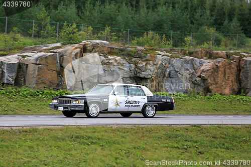 Image of Cadillac Police Car on Patrol