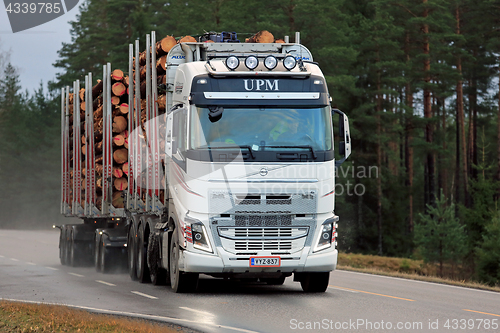 Image of White Volvo FH Logging Truck on Highway