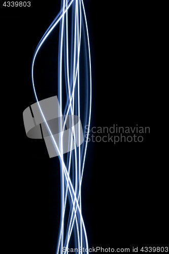 Image of black background with some light streaks