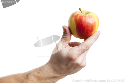 Image of an apple holding by a male hand
