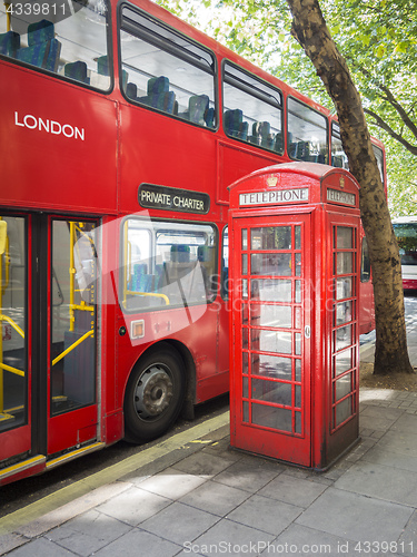 Image of a red bus and typical phone box of London