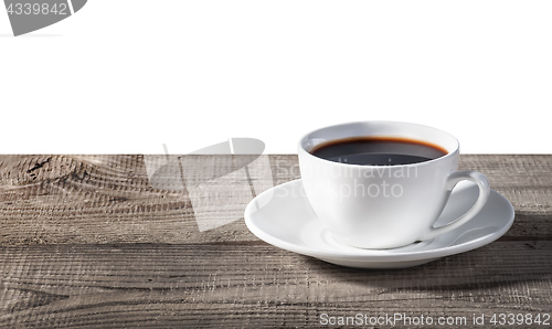 Image of Cup of coffee on a wooden table