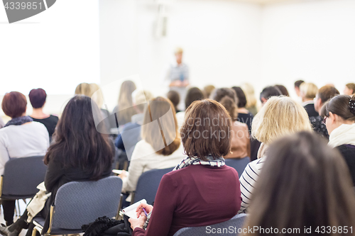 Image of Woman giving presentation on business conference.