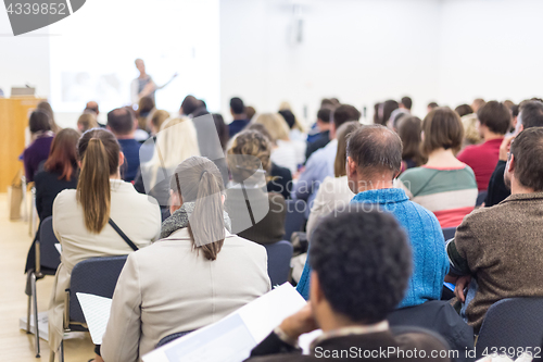 Image of Woman giving presentation on business conference.