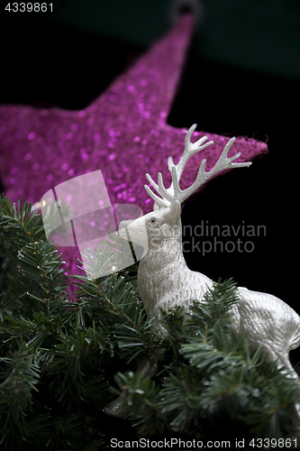 Image of a christmas decoration with a star and a deer