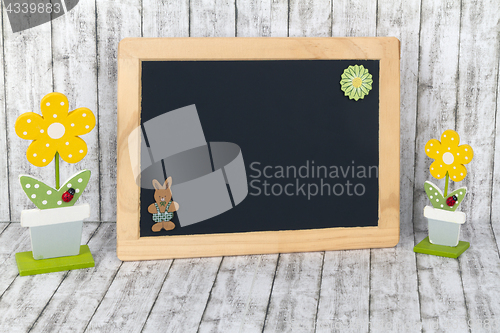 Image of Blank Blackboard with decorative Flowers