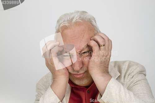 Image of Senior man with strong headache