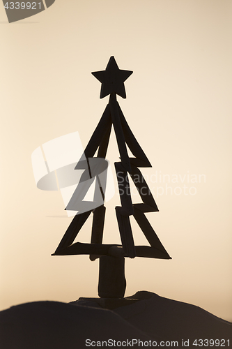 Image of Driftwood Christmas tree silhouette sunrise