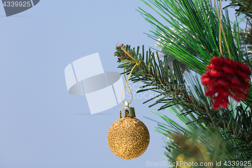 Image of Christmas tree decorated with baubles closeup