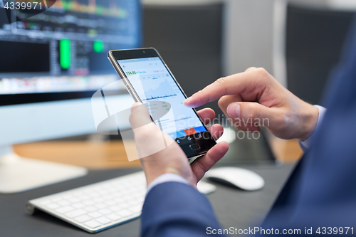 Image of Close up of businessman using mobile smart phone.