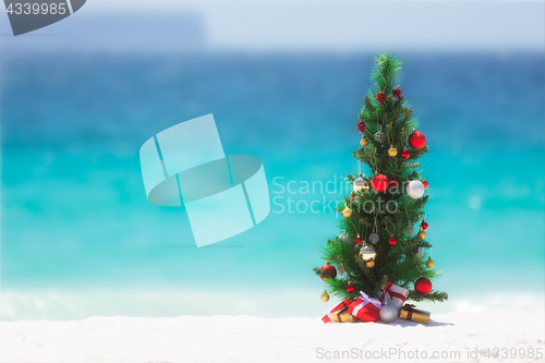 Image of Christmas tree on the beach in summer