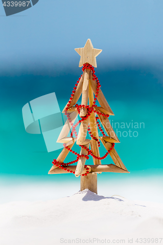 Image of Christmas in the summer - Driftwood Christmas tree on beach