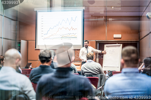 Image of Speaker Giving a Talk at Business Meeting.