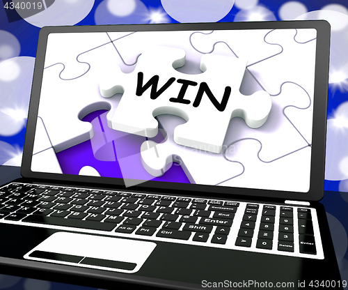 Image of Win Puzzle On Laptop Shows Victory