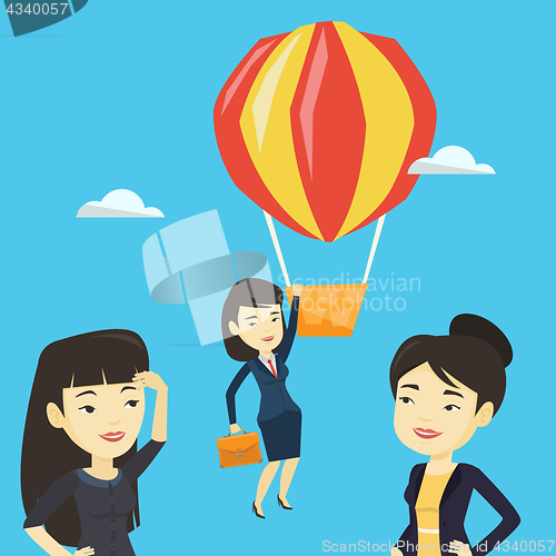 Image of Business woman hanging on balloon.