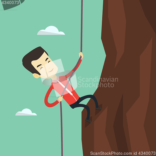 Image of Business man climbing on the mountain.