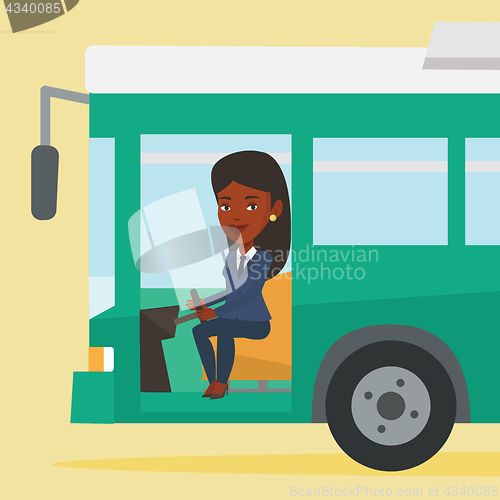 Image of African bus driver sitting at steering wheel.