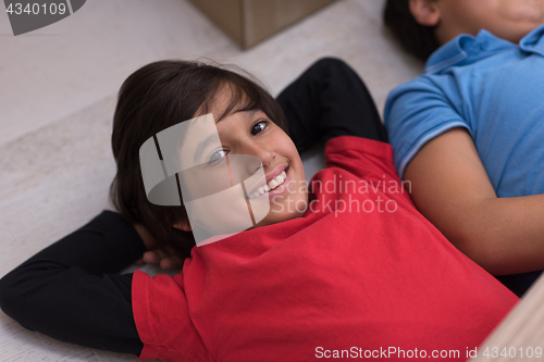 Image of young boys having fun on the floor