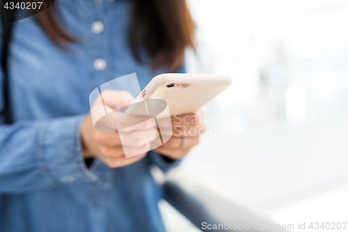 Image of Woman touch on mobile phone