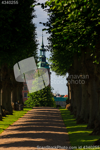 Image of A beautiful summer green ale leading to Frederiksborg Palace in 