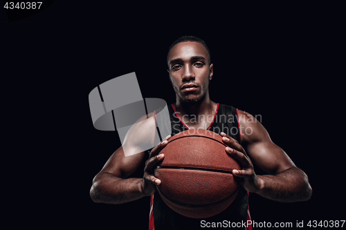 Image of The portrait of a basketball player with ball