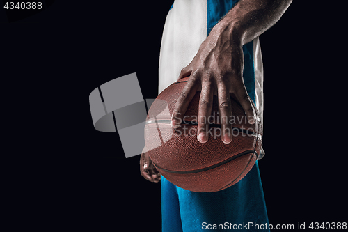 Image of The portrait of a basketball player with ball