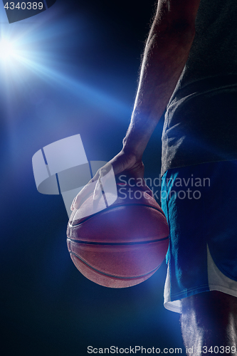 Image of The portrait of a basketball player with ball