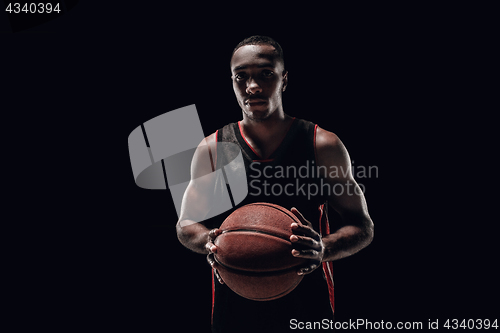 Image of The portrait of a basketball player with ball