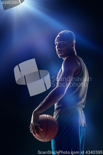 Image of The portrait of a basketball player with ball