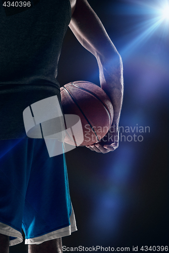 Image of The portrait of a basketball player with ball