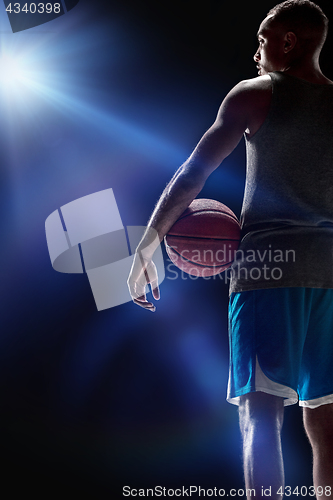 Image of The portrait of a basketball player with ball