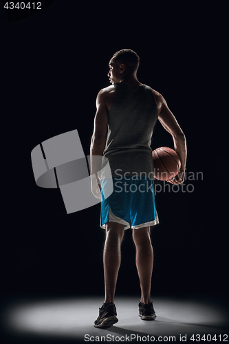 Image of The portrait of a basketball player with ball