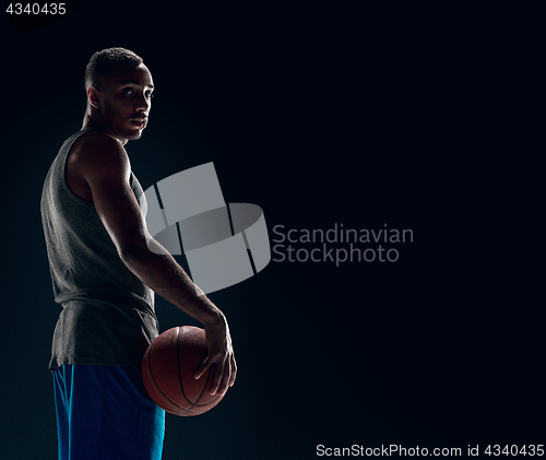 Image of The portrait of a basketball player with ball