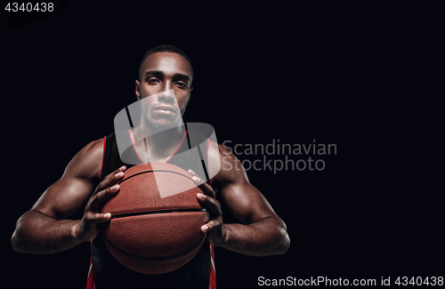 Image of The portrait of a basketball player with ball