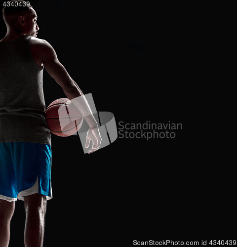 Image of The hand of a basketball player with ball