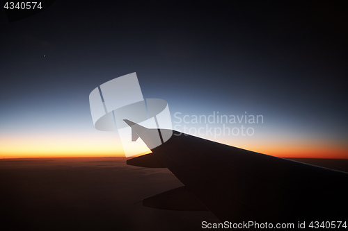 Image of Seeing the sunset on flight