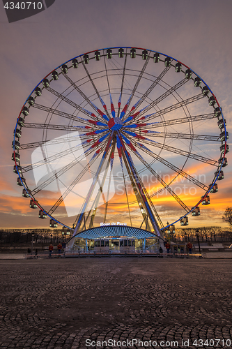 Image of Place de la Concorde at sunset. Ferris wheel and Egyptian obelis