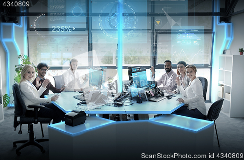 Image of business team at office with virtual screens