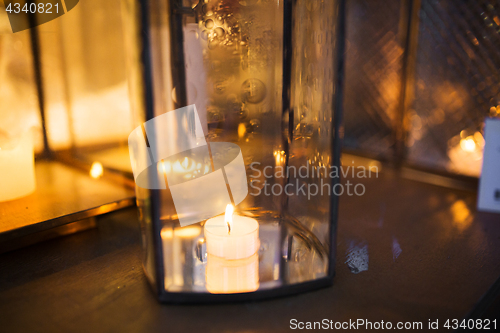 Image of close up of lantern with candle burning inside