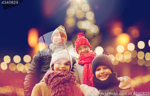 Image of happy family outdoors at christmas eve