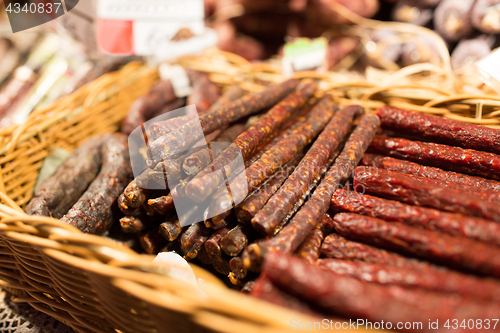 Image of smoked meat products at market or butcher shop