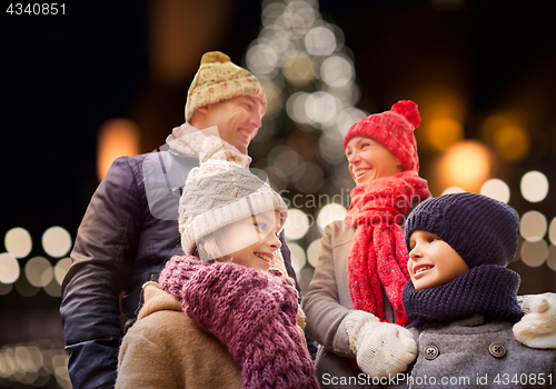 Image of happy family outdoors at christmas eve